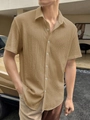 Close-up of khaki seersucker texture on a short-sleeve button-down men's casual shirt - S / Tops / Khaki