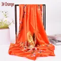 Detail of orange peony silk scarf draped on a metal frame with floral patterns - 90cm*90cm / Orange