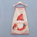 Detail view of a beige Christmas apron featuring a cute gnome and red trim on a hanger - Beige Christmas Gnome Pattern (Style E)