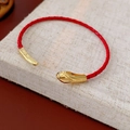 Close-up of red woven cord bracelet with gold metal accents and sleek bionic design - Minimalist Snake Head Red Cord Style (HB5012-15)