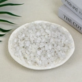 Natural white quartz crystal fragments in a white plate for home decor and healing - 100g Of Fluffy White Crystal (7-9mm)