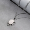 Elegant silver rope chain necklace with an oval white gemstone and rhinestone accents - Oval Rose Quartz