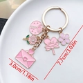 Detailed view of pink cherry blossom and heart enamel keychains with dimension markings - Pink Heart Rose Envelope Style (ER877)