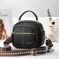Black lychee leather round crossbody bag with three zipper layers and a patterned strap - Black
