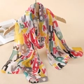 Long chiffon scarf with vibrant colorful letter print hanging on a wooden hanger - Colorful Letter Print