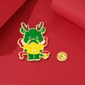 Cartoon Chinese dragon enamel pin with green finish holding a gold ingot coin - Wealth-Attracting Green Dragon