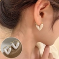 Sweet cream heart earrings with vintage gold metal closure shown on model - Cream White Glazed Heart Dangle Earrings(ED2009)