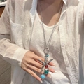 Silver starfish pendant necklace with colorful beads on a white shirt worn by a model - 102# Silver Starfish Bead