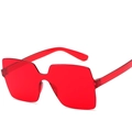 One-piece candy-colored rimless oversized square sunglasses in vibrant transparent red - Red