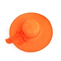 Macro shot of bright orange sun hat showing woven straw texture and large silk ribbon bow - M (56-58cm) / Orange