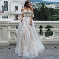 Elegant white lace wedding dress with off-shoulder neckline and layers of soft tulle - US Size 2 (S) / White