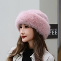 Women's warm faux fur beret hat in soft pink with a thick fluffy texture and silk sheen - Pink