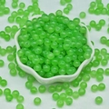 Macro view of transparent green chalcedony beads in a white petal ceramic bowl - 4mm / Light Green