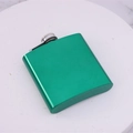 Portable 6oz green stainless steel hip flask with metal screw cap on marble - Green