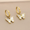 Detailed macro view of golden butterfly earrings with white shell inlay and round hoops - Butterfly Style (KE113947-KSP)