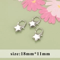 Three silver star lobster clasps in 18mm x 11mm size on a light green background - Star Shape 18mm*11mm