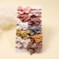 Close-up of 10-piece baby bow headbands featuring embroidered cotton and knit textures - 10Pcs Set