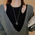 Silver interlocking triple-ring pendant necklace on a model with a knit sweater - Triple Ring Interlocking Style (32#)
