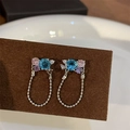 Silver drop earrings with blue round gemstone and pink zircon pavé on velvet display - A27 Silver Blue Gem Hoop Earrings