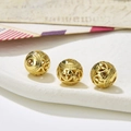 Macro detail of vintage hollow golden metal beads for DIY necklace and bracelet jewelry - Style 20
