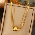 Elegante goldene Doppelhalskette mit Schlangenkette und spiegelpoliertem Kugelanhänger - 011
