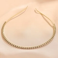 Detail of elegant gold-tone headband decorated with sparkling clear rhinestones on silk - Small Rhinestone Gold (FG0009-12)