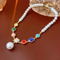 Detail of colorful crystal and pearl拼接 necklace on a dark brown surface - Colorful