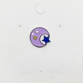 Macro view of a circular enamel moon and star pin with high-quality metal finish - 78*Moon Hugging Star Pin