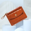 Slim crocodile pattern leather card holder with zipper pocket and snap closure in orange - Coffee