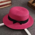 Detail of rose pink boater straw hat with black ribbon bow on vintage background - M (56-58cm) / Rose Red