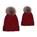 Detail of red cable knit pom-pom hats showing ribbed texture and faux fur detail - Parent-Child Set / Dark Red