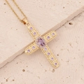 Close-up of 18K gold cross pendant featuring micro-set purple zircon and filigree details - Light Purple