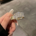 Close-up of golden metal hair claw clip with sparkling rhinestones held in hand - High Ponytail [Full Rhinestone] Gold