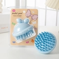 Light blue bow-shaped silicone scalp massager brush for hair washing in original packaging - PVC Box / Blue