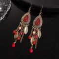 Close-up of vintage bronze earrings with red beads, metal leaves and long tassels - Ear Hook-Red