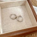 Minimalist silver geometric C-shaped hoop earrings presented in a wooden jewelry box - Faceted Silver Ear Buckle (63#)