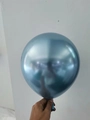 Single 10-inch shiny blue metallic party balloon with chrome finish and round shape - Light Blue
