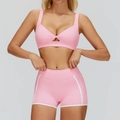 Pink yoga set featuring twist-front sports bra and white-trimmed high-waisted shorts - S / Bra + Shorts / Sakura Pink