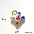 Hand-painted ceramic bird pendant charm with blue and red floral patterns, 2cm size - Hand-painted Ceramic Bird Pendant