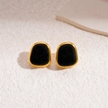 Close-up of geometric black flocking earrings with a polished gold metal border - Silver Earring Post - Black - Square