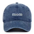 Detailed view of white 'mom' embroidery on dark blue washed cotton baseball cap - MOM / Navy Blue