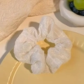 Elegant white organza scrunchie with pleated texture on a ceramic tray for hair styling - Puff White