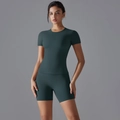 Close-up of a dark green nylon sports set with short sleeve top and high waist shorts - S / Wood Green