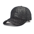 Detailed view of women's black glitter baseball cap with silver sequins and curved brim - M (56-58cm) / Black