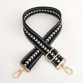 Detail of black nylon strap with white arrow pattern and golden metal buckles - Black Strap Silver Buckle