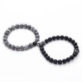 Close-up of 8mm white turquoise and black lava stone crown bracelets with magnetic clasp - 09-Map Stone & Frosted Stone