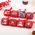 Christmas themed mini tinplate wallet with red cartoon patterns and zipper closure - Christmas Series