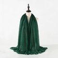 Detailed close-up of dark green crinkle cotton linen scarf with frayed tassel edges - Dark Green