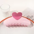 Macro detail of sweet pink heart-shaped hair claw clip on a decorative white ceramic tray - Heart Semicircle / Light Pink