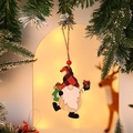 Christmas wooden gnome ornament with red plaid hat hanging on a tree branch - Style 2 (Gnome with Gift)